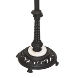 Rustic loon pine needle floor lamp base close-up.