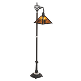 Rustic loon pine needle floor lamp with amber mica shade lit.