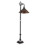 Rustic floor lamp with loon and pine needle design shown unlit.
