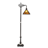 Side angle lit view of amber mica lamp with loon cutout.