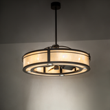 Illuminated chandelier fan glowing softly in a warm ambient room setting.