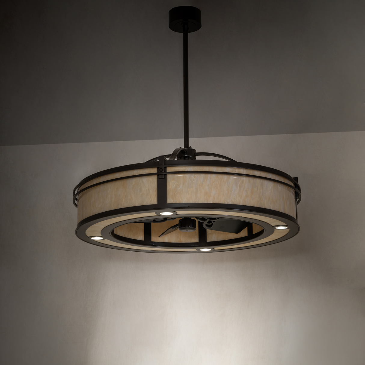 Lower angle room shot showing full illuminated fixture and downward lighting pattern.