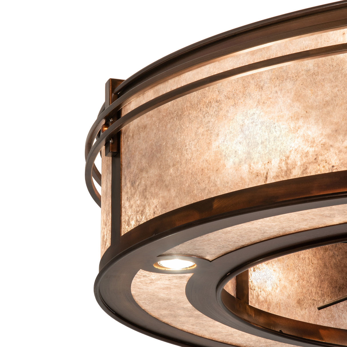 Close-up of mica diffuser edge with bronze trim and layered glow.