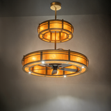 Warm ambient-lit view of Sargent chandelier fan glowing in golden tones.