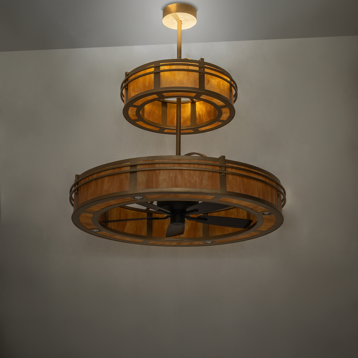 Dim-lit room view of Sargent chandelier fan with warm amber glow.
