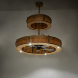 Illuminated angle view showing Sargent chandelier fan’s gold finish and design.