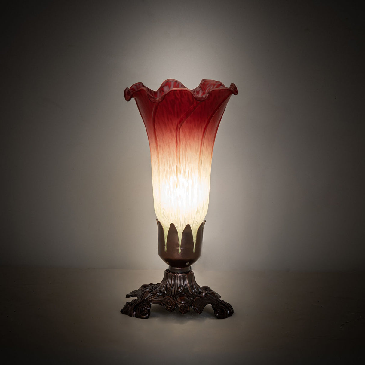 Seafoam and Cranberry Pond Lily Mini Lamp glowing softly in an ambient setting.