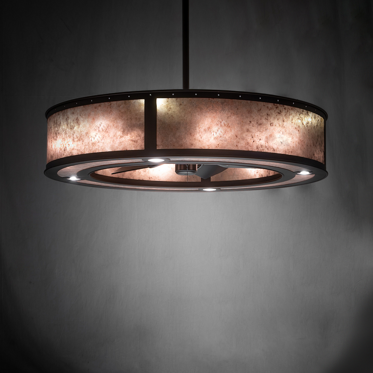 Smythe Craftsman chandelier fan illuminating wall with warm ambient light.