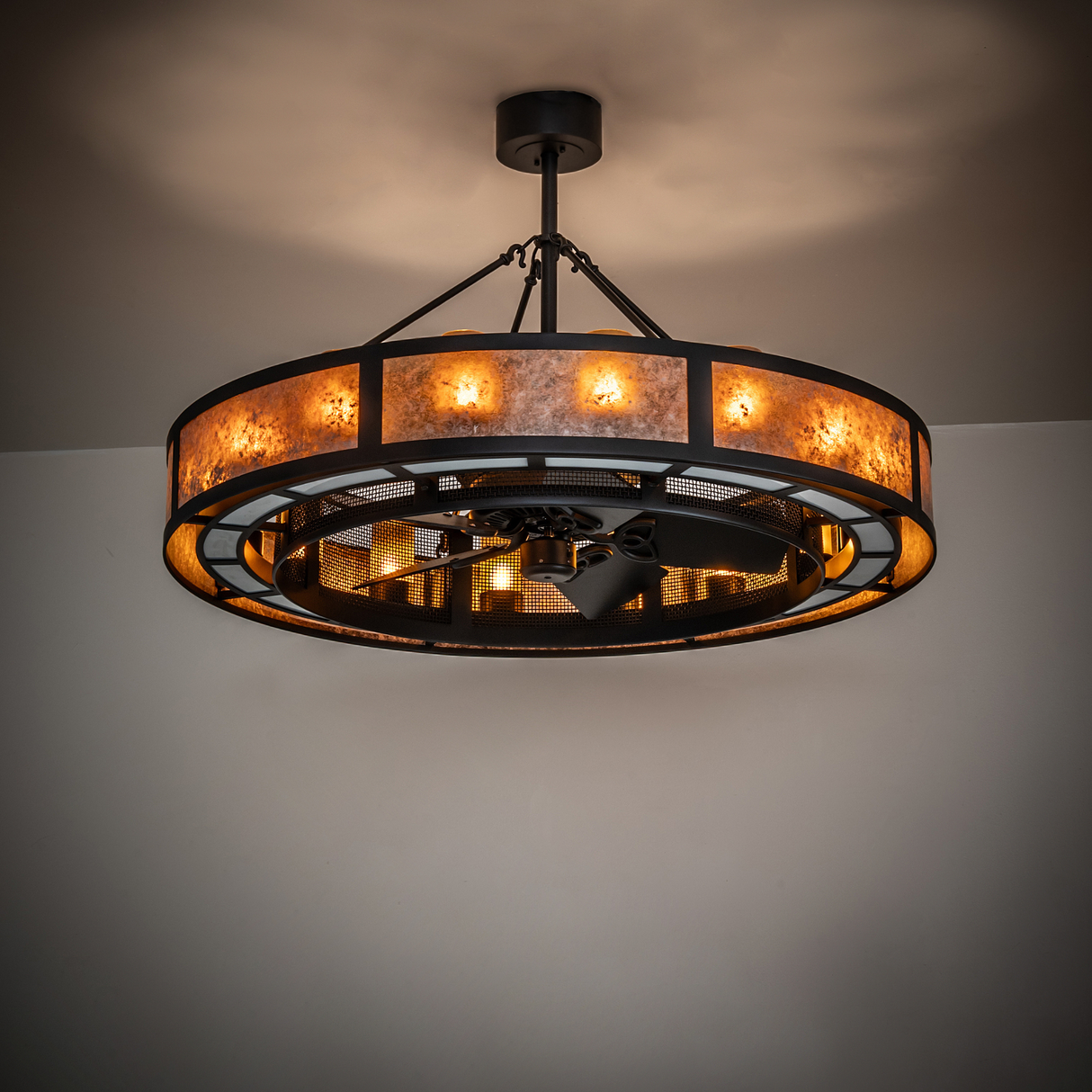 Smythe Craftsman Chandel-Air chandelier fan illuminated in room ambient light.