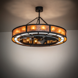 Smythe Craftsman Chandel-Air chandelier fan glowing warmly in ambient lighting.