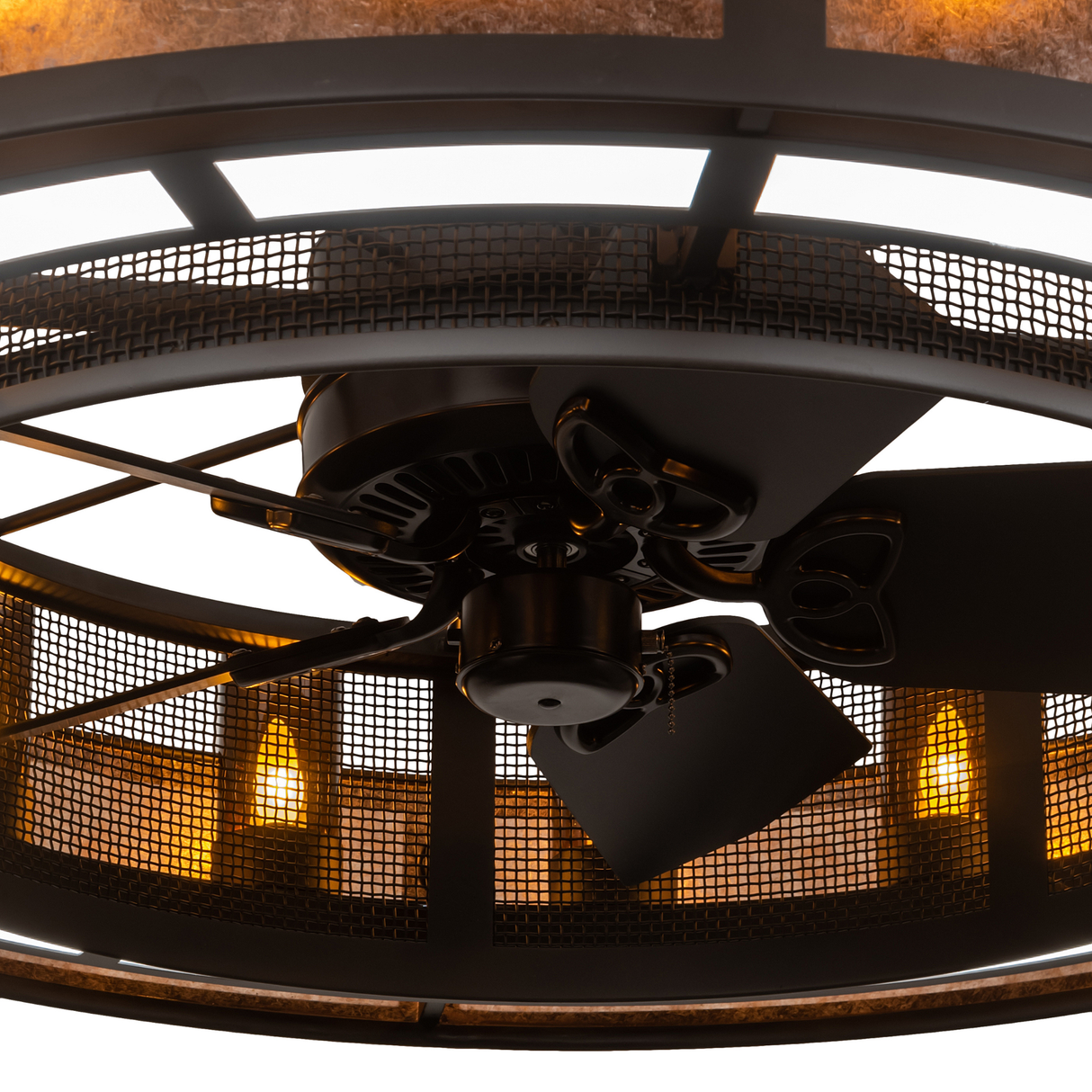 Close-up showing fan blades framed by illuminated mesh grille and glass lights.