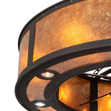 Close-up of amber mica panel with bronze trim and soft illumination.