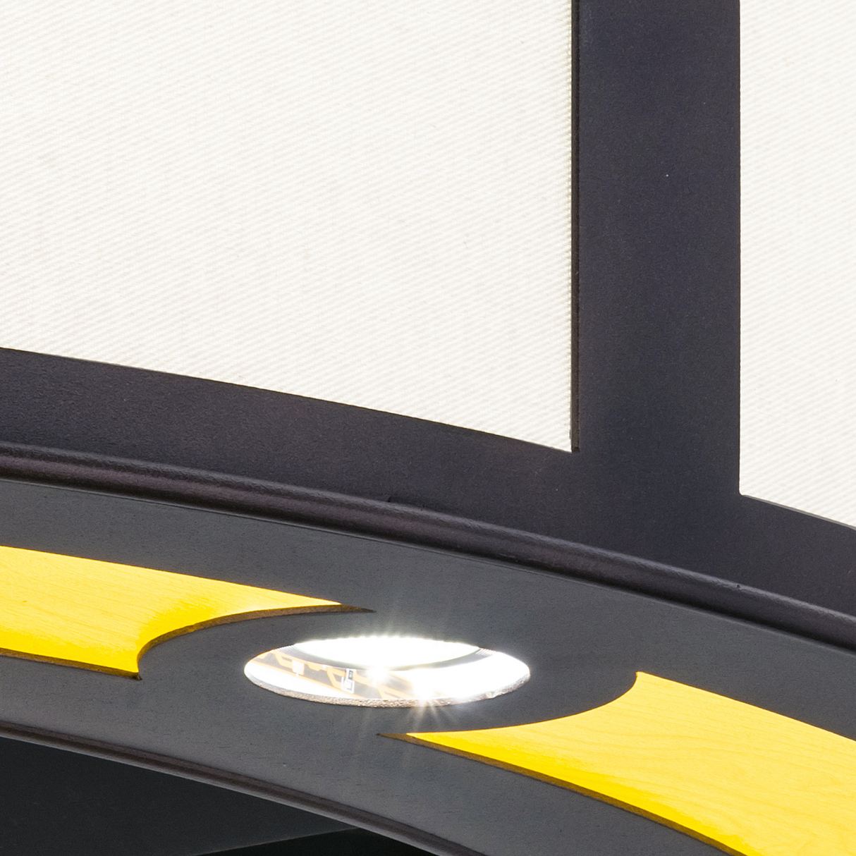 Edge detail showing light glow and bronze frame contrast on diffuser.