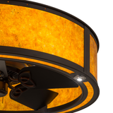Closeup of amber mica shade and bronze detailing.