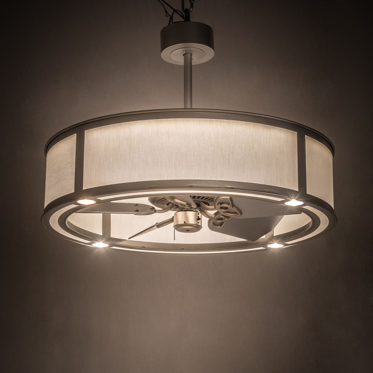 Smythe Craftsman Chandel-Air illuminated in soft ambient light within a modern room.