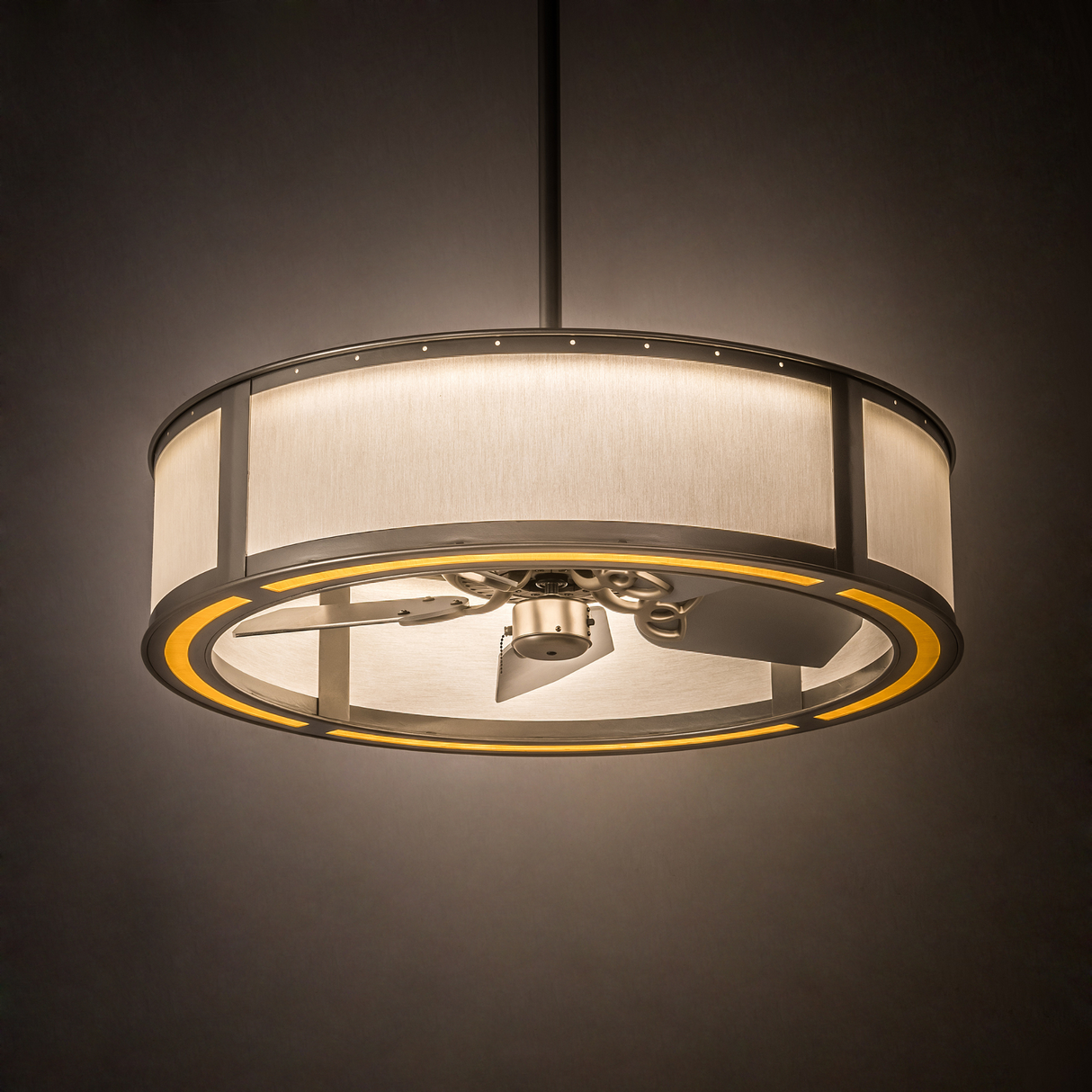 Illuminated Smythe Craftsman Chandel-Air glowing warmly in a softly lit interior.
