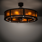 Smythe Craftsman Chandel-Air illuminated in room setting with warm amber glow.