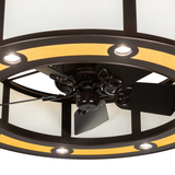Close-up of fan blades and warm LED downlights under maplewood trim.