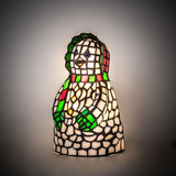 Snow woman accent lamp illuminated showing detailed mosaic design.