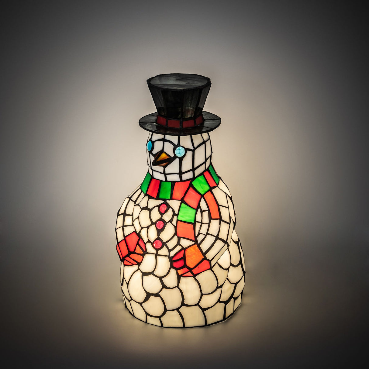Illuminated view of the Snowman Accent Lamp showcasing its vibrant holiday colors.