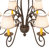 Closeup of Squire chandelier center with twisted iron scrollwork.