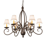 Squire six light chandelier illuminated with white fabric shades.