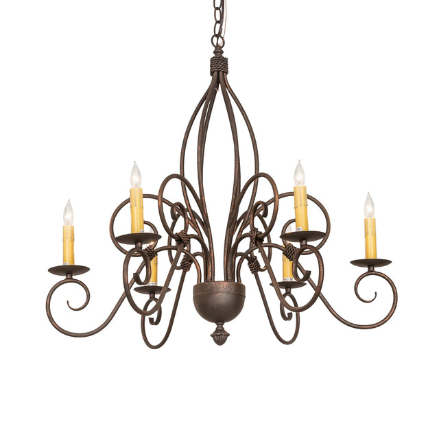 Squire 6-light chandelier illuminated with candle bulbs, warm glow on gray wall.