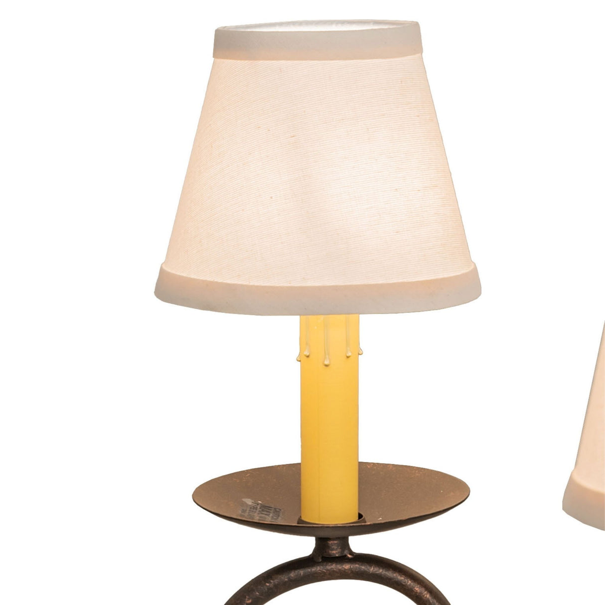 Close-up of white fabric shade with faux candlelight.