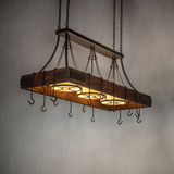 Ambient lit view of Steamboat chandelier over kitchen island.