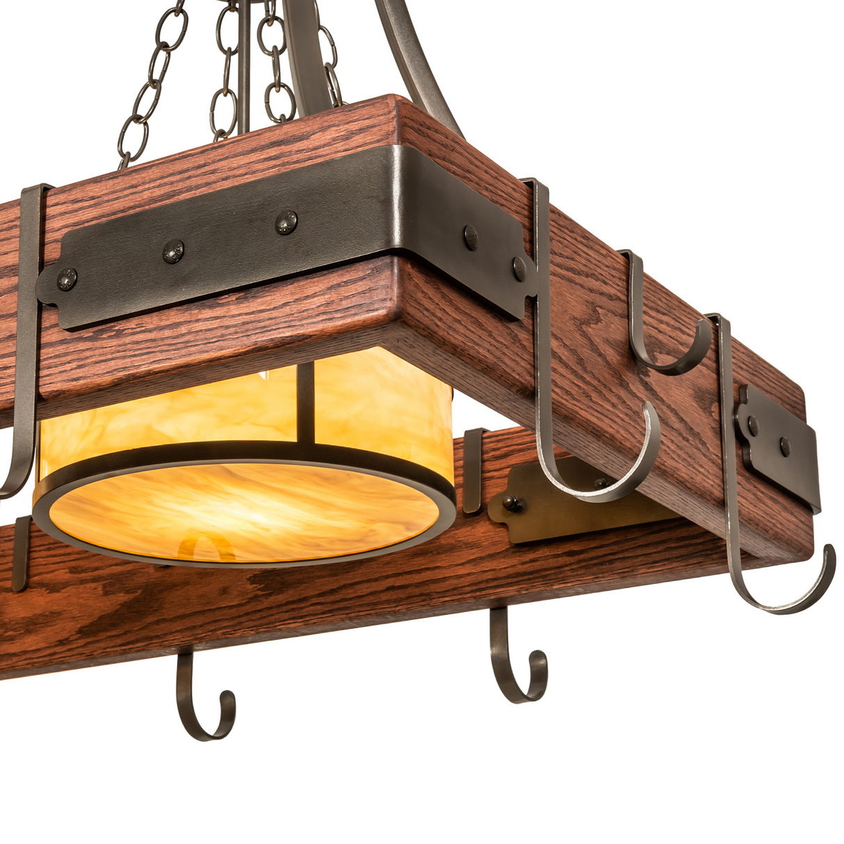 Close-up of Steamboat pot rack with glowing amber glass shade.