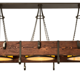Detailed view of Steamboat chandelier’s rustic wood and steel design.