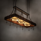 Kitchen chandelier glowing with bronze hardware and wood frame.