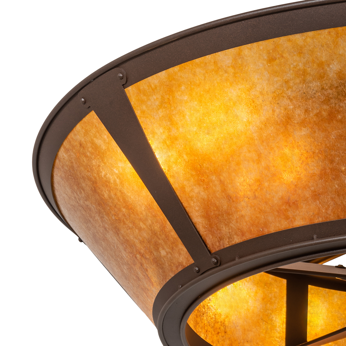 Close-up of glowing amber mica diffuser with bronze framing.
