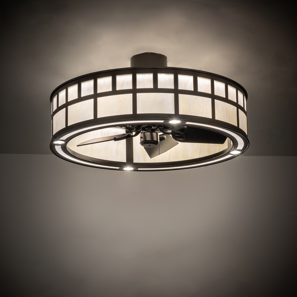 T Mission Chandel-Air softly illuminating a room with warm bronze glow.