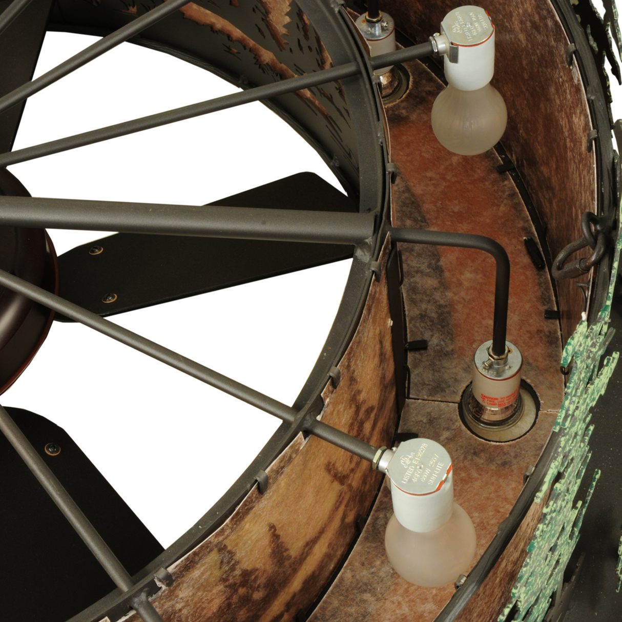 Close-up of bulb sockets and metal framework inside Tall Pines Chandel-Air fixture.