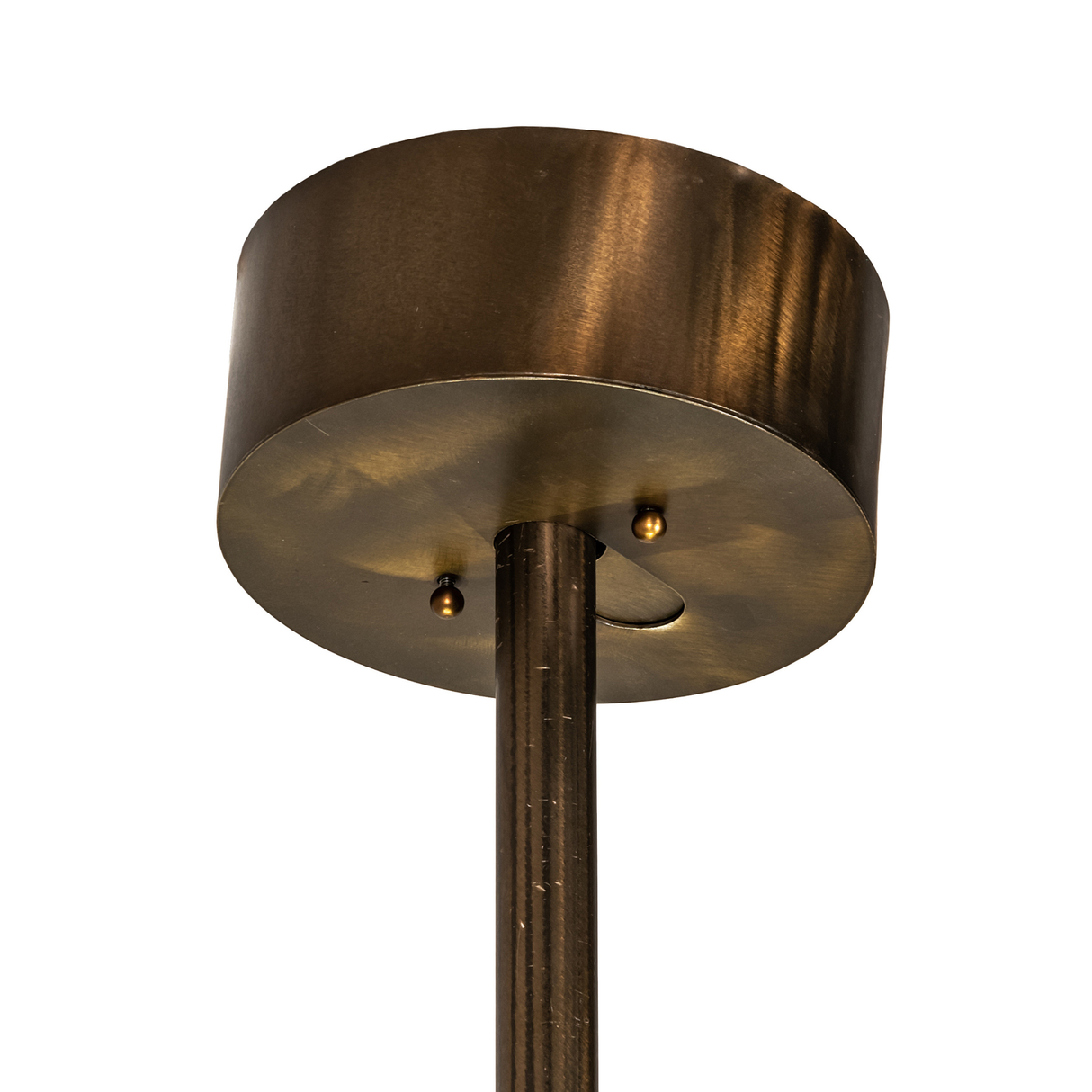 Close-up of ceiling canopy and rod with bronze finish.