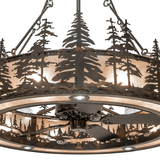 Close-up of handcrafted pine tree silhouettes over Silver Mica shade.