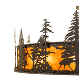 Close-up of pine tree cutout detailing and bronze craftsmanship.