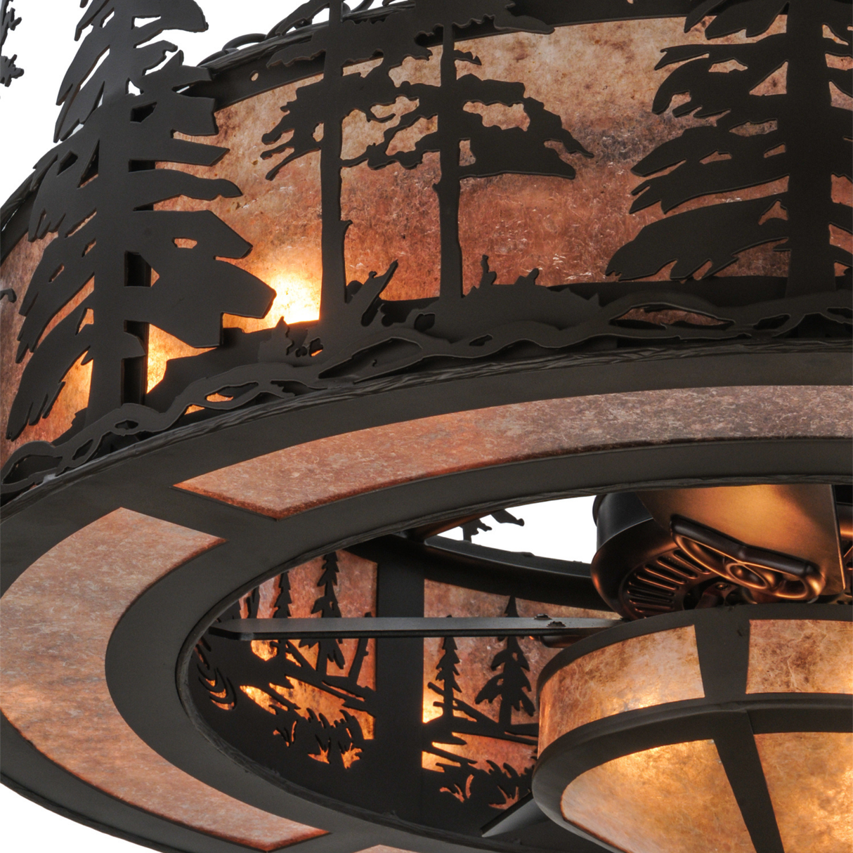 Closeup view of mica diffuser and pine silhouette detailing.