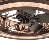 Close-up of fan motor and tree-patterned diffuser panel.