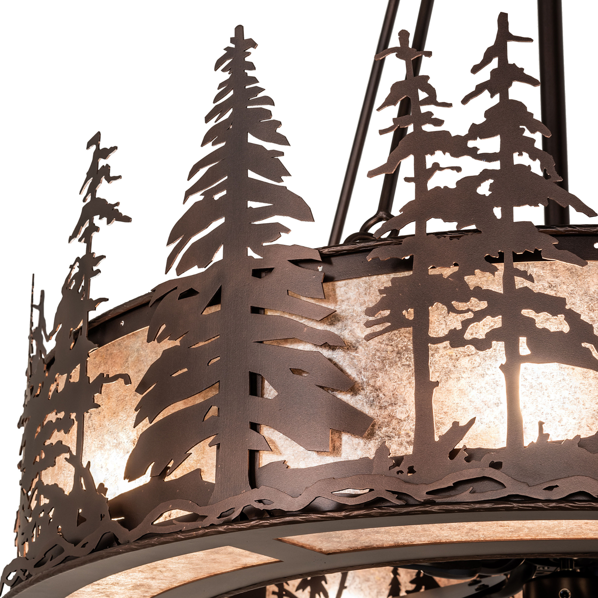 Close-up of pine tree metalwork with glowing mica background.