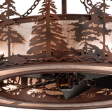 Closeup showing glowing mica panels and pine tree cutout detail.