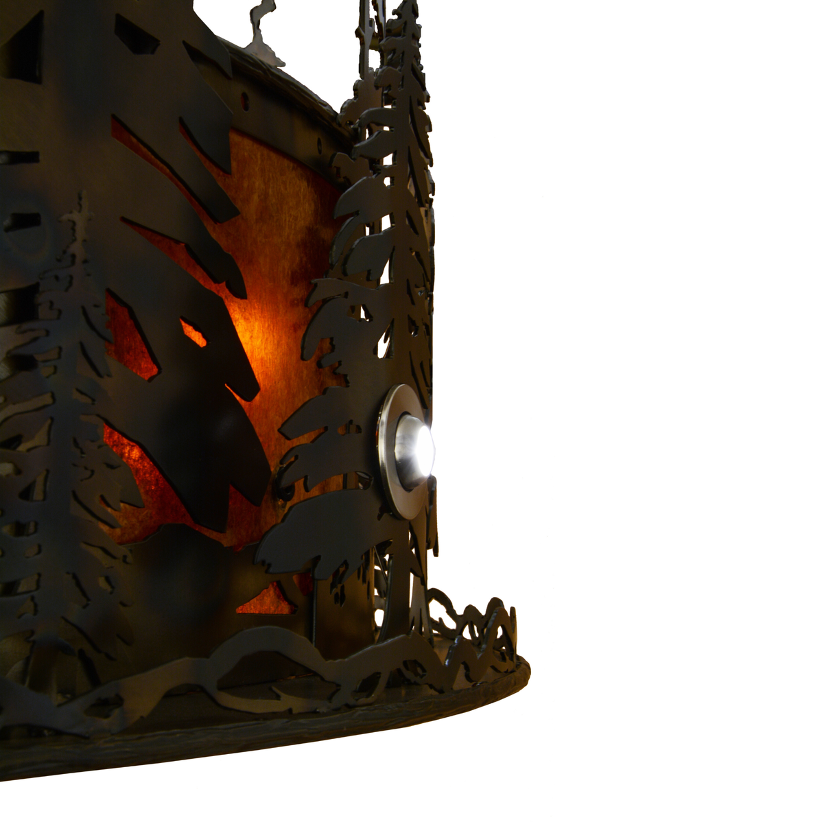 Closeup showing illuminated pine tree silhouettes against amber mica.