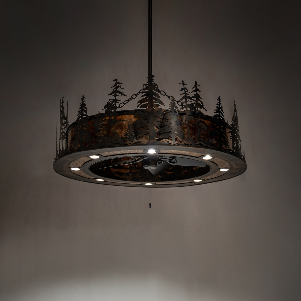 Tall Pines Chandel-Air lit dark room view showing rustic copper frame and pine design.