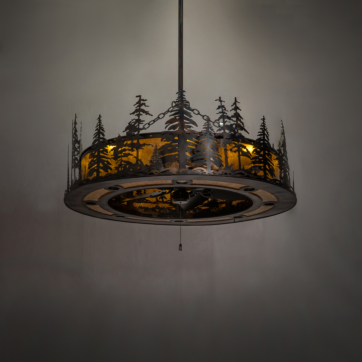 Tall Pines Chandel-Air dark room view with mid-level illumination revealing pine tree detailing.