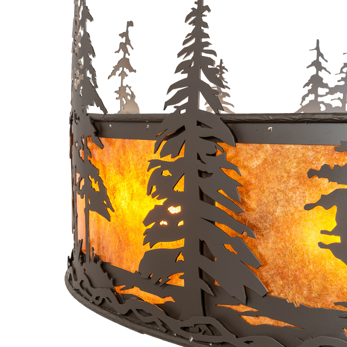 Close-up of handcrafted pine tree silhouette and mica texture.