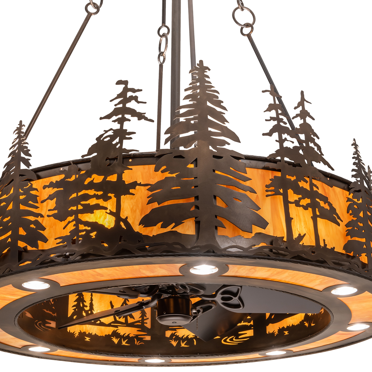 Close-up of pine tree cutouts on Tall Pines Chandel-Air amber shade.