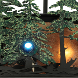Detailed view of fan blades and woodland scene on glowing mica diffuser.
