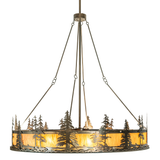 Front lit view showcasing pine tree silhouettes and glowing amber diffuser.