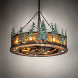 Warm illuminated Tall Pines Chandel-Air hanging in softly lit room.